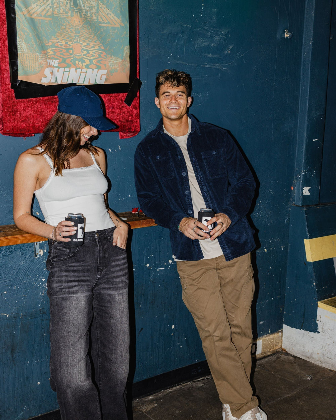 Man in bar wearing Corduroy Workshirt in Navy and Supima Tee in Bone with Stretch Cargo Pant in Desert 