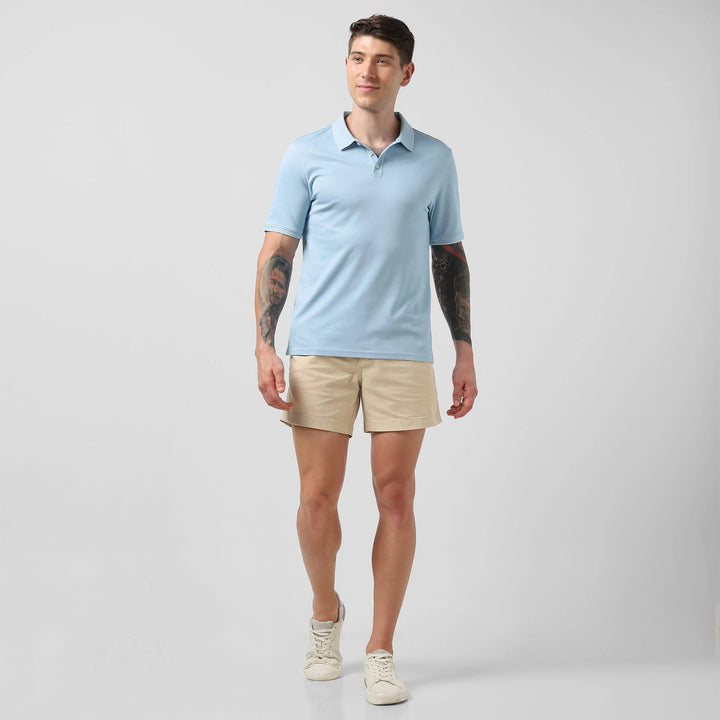 Range Polo Sky Blue full body on model wearing Stretch Short Sand Dune