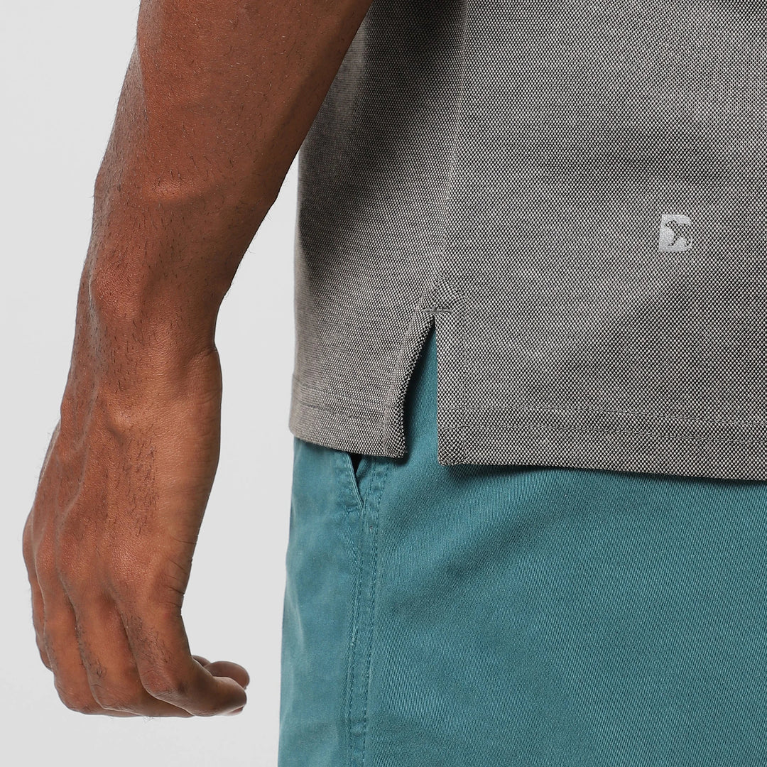 Range Polo Charcoal close up of Bearbottom B logo and split hem