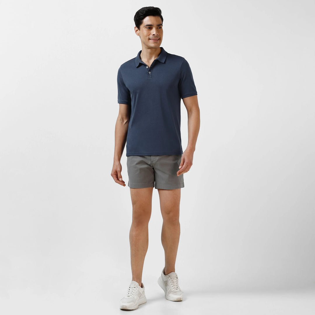 Range Polo Navy full body on model worn with grey chino shorts