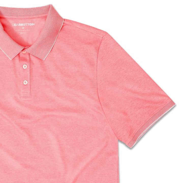 Range Polo Coral front close up with ribbed collar, ribbed short sleeves, and 3 white buttons