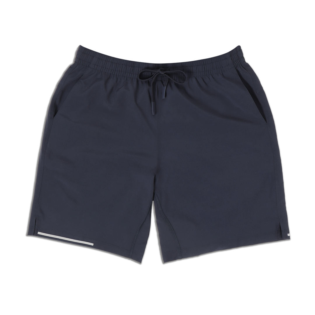 Run Short v2 7" Navy front with elastic waistband, dyed-to-match drawstring with rubberized tips, two front pockets, split hem, and reflective line on bottom right hem