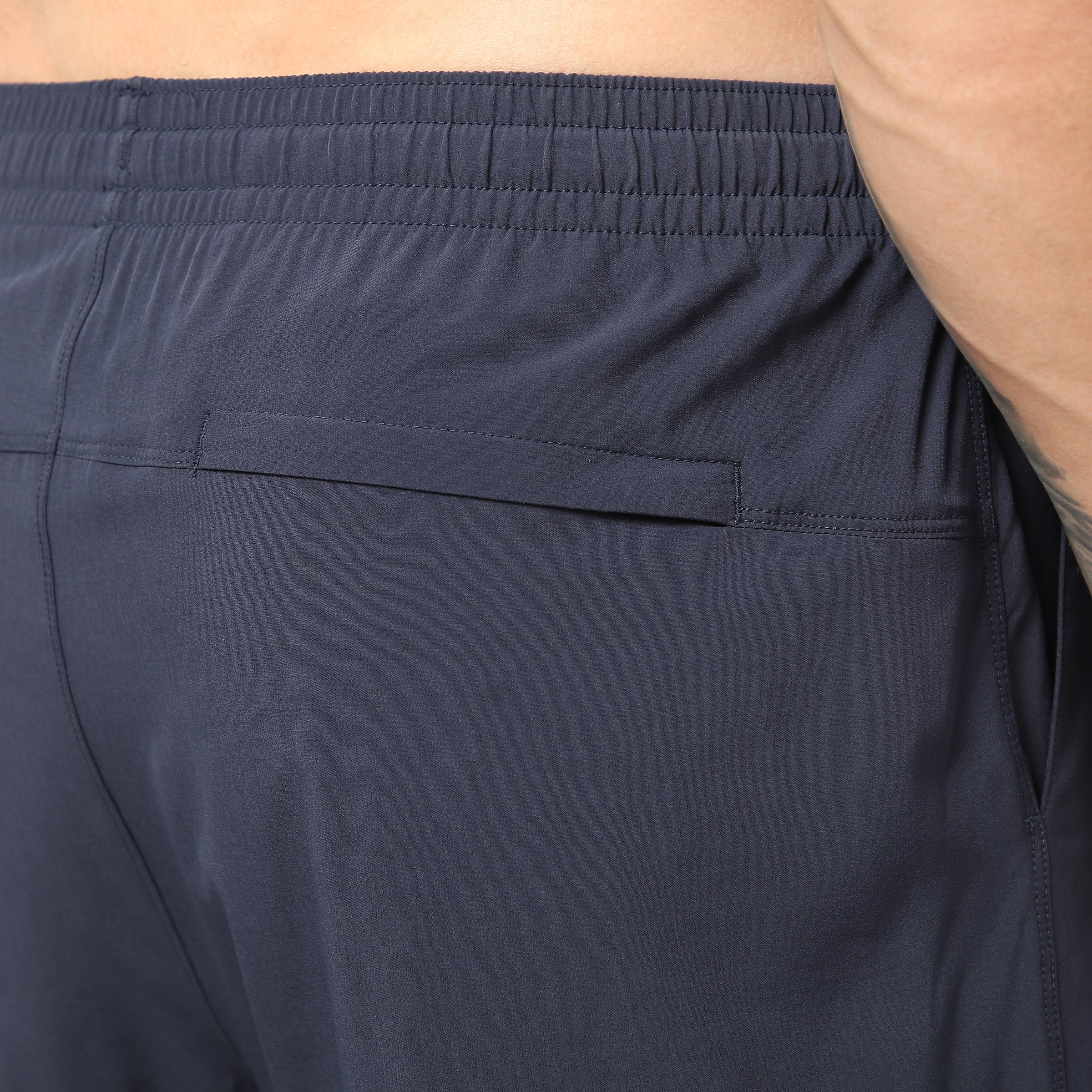 Run Short v2 7" Navy close up of back right hidden zipper pocket