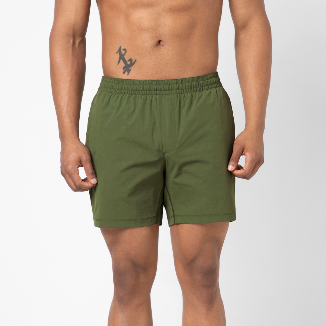 Person wearing Atlas Short Military Green 5.5" shorts on a plain background