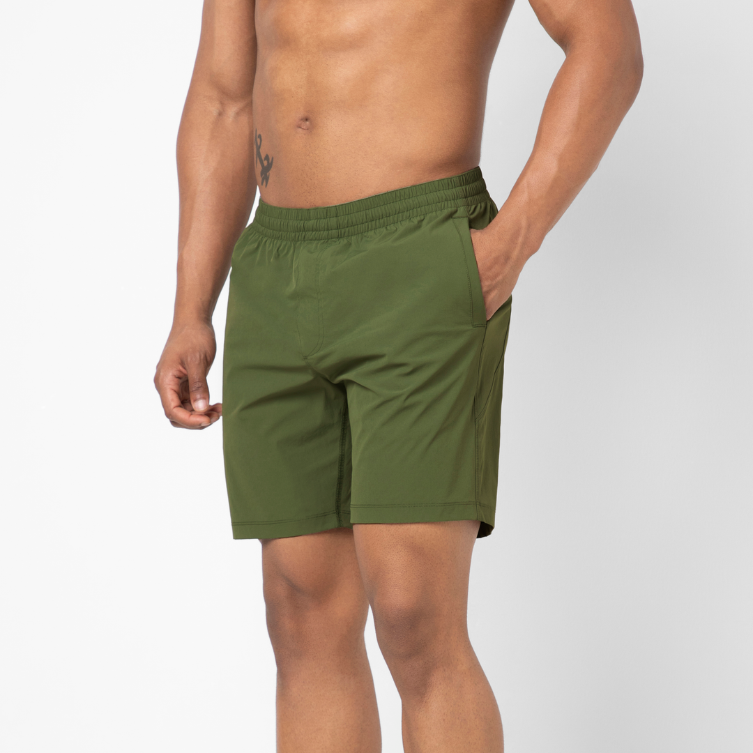 Atlas Short Military Green 7" side on model with hand in pocket