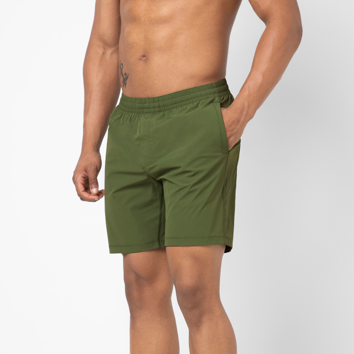 Atlas Short Military Green 7" side on model with hand in pocket