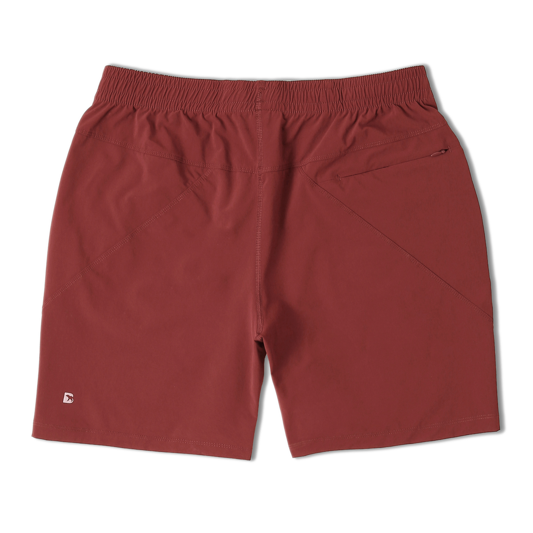 Atlas Short 7" Maroon Back with elastic waistband, back right zippered pocket, and small reflective logo of Bear drawn inside the letter B in bottom left corner