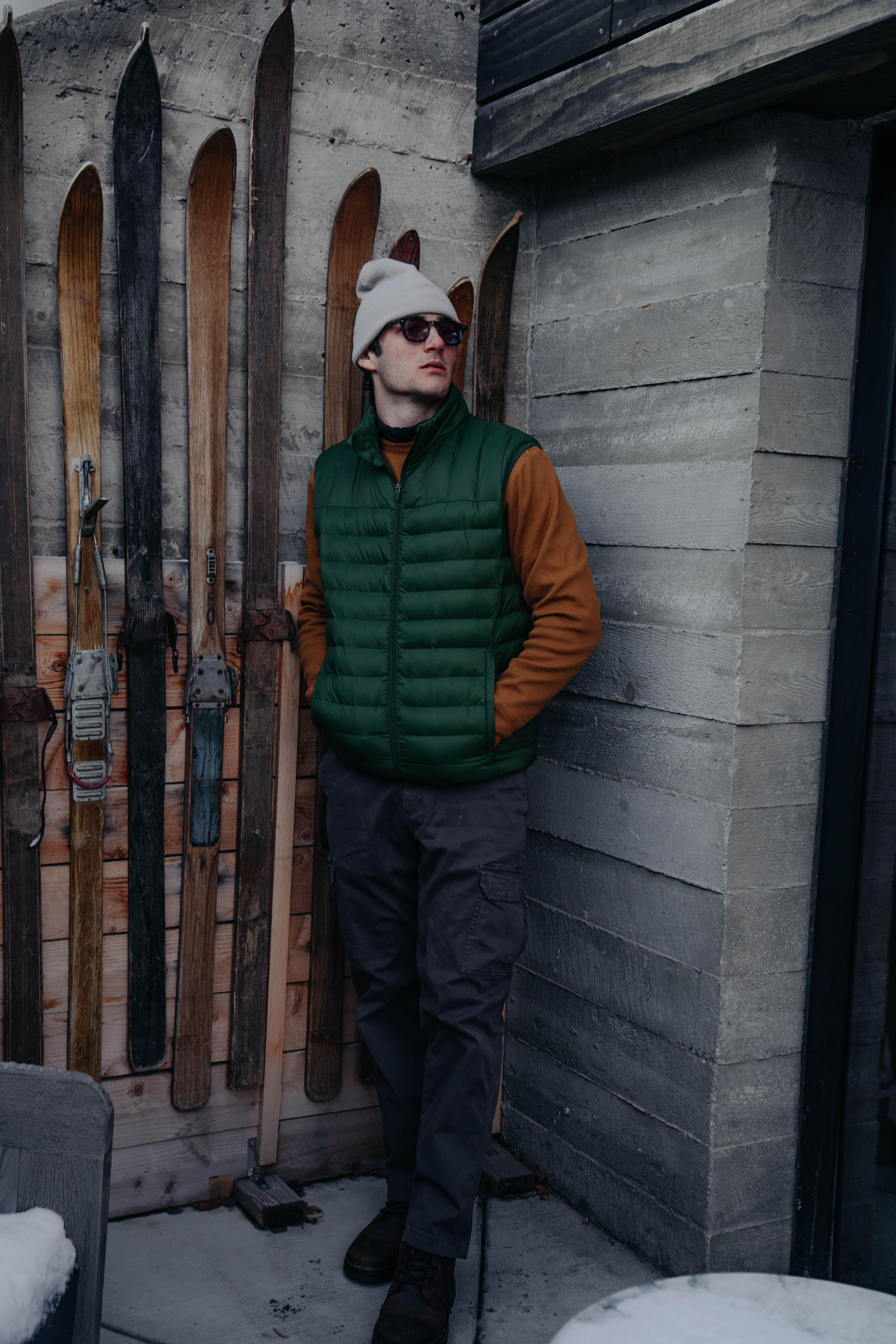 Man in Thermal Knit Crew Cidar, PrimaLoft Packable Vest in Pine Green, and Stretch Cargo Pant in dark Grey