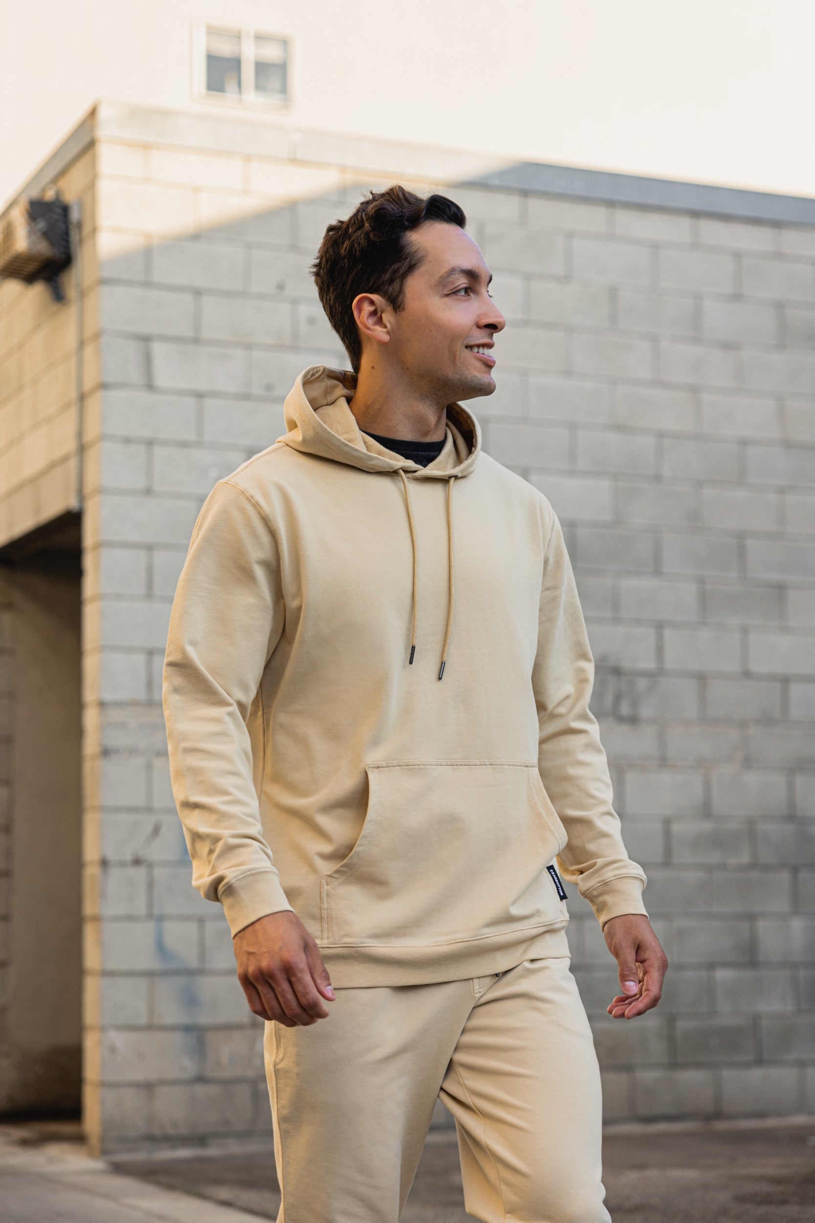 Model wearing Lounge Hoodie in Khaki and Lounge Jogger in Khaki