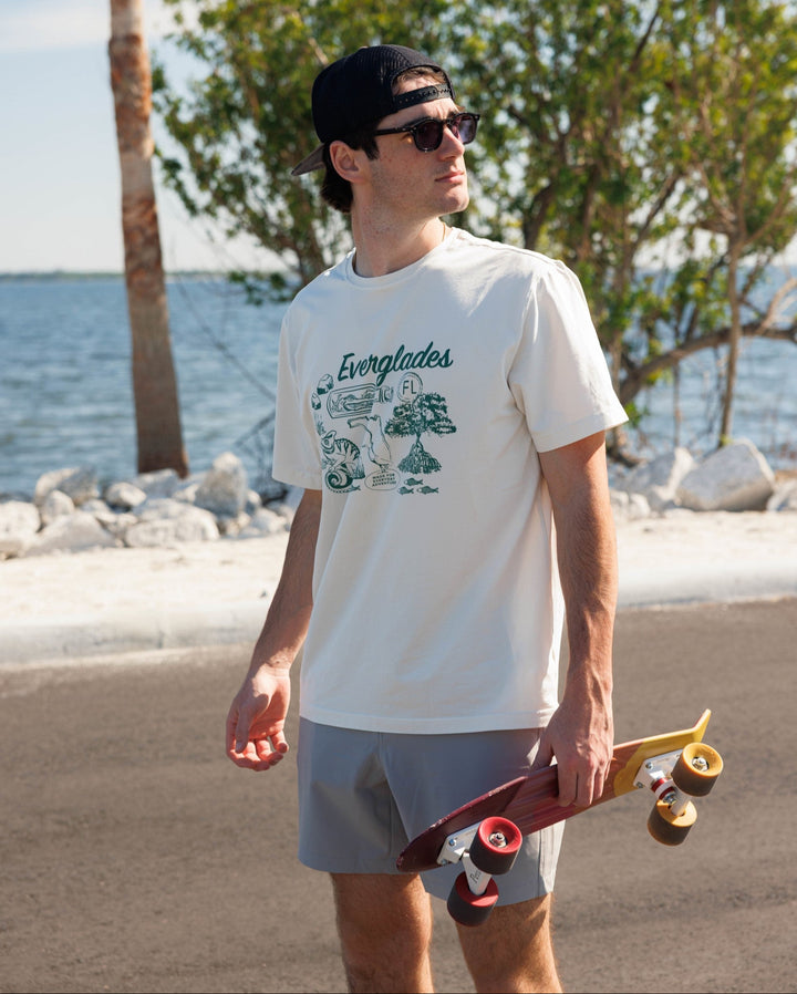 Natural Dye Graphic Tee Everglades on model at beach