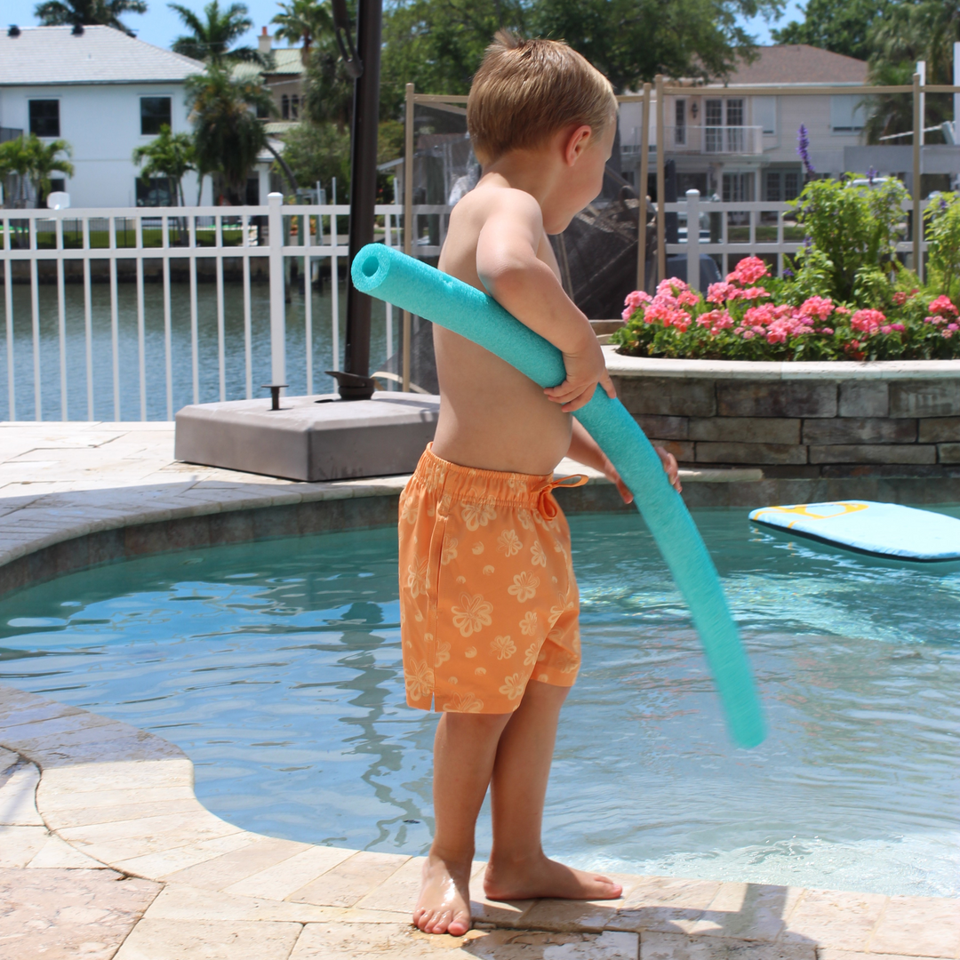 Boys Stretch Swim Bloom on model carrying noodle