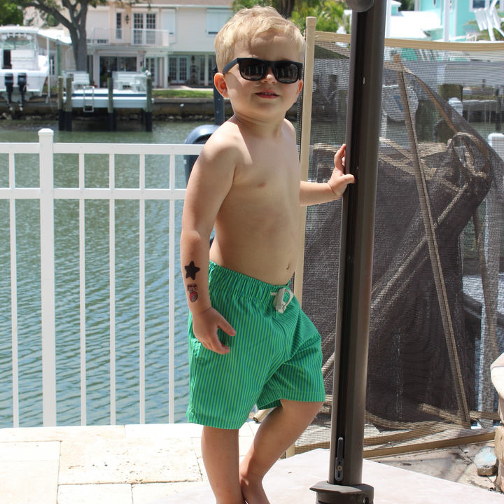 Boys Stretch Swim Gulf Stripe on model standing by pool posing