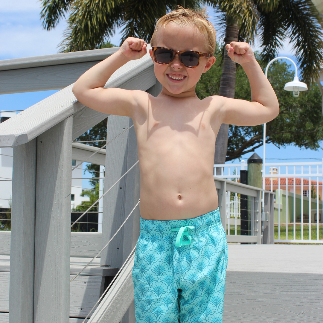 Boys Stretch Swim Shell on model flexing arms