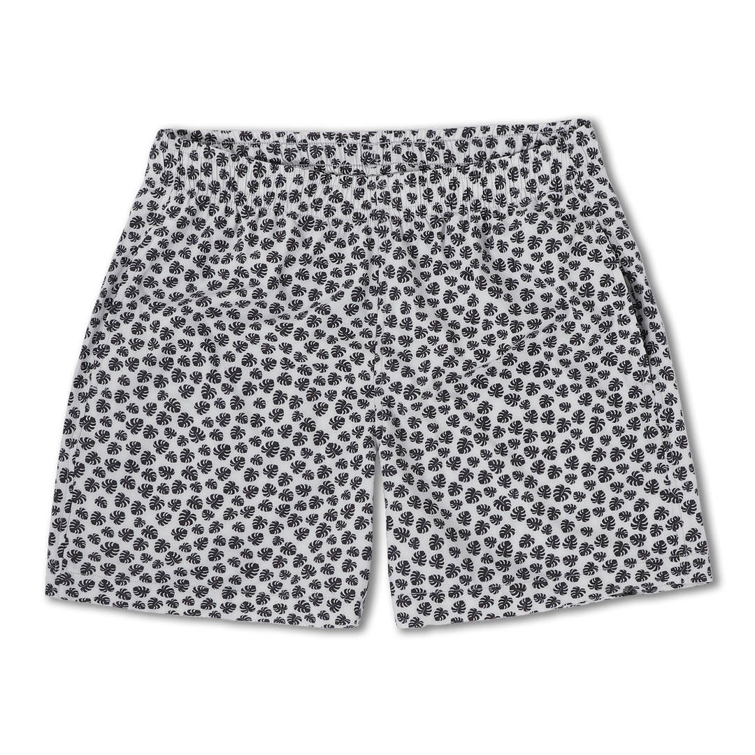Cabana Short 5.5" Monstera a white print with small black monstera leaves on a short with an elastic waistband and two side seam pockets