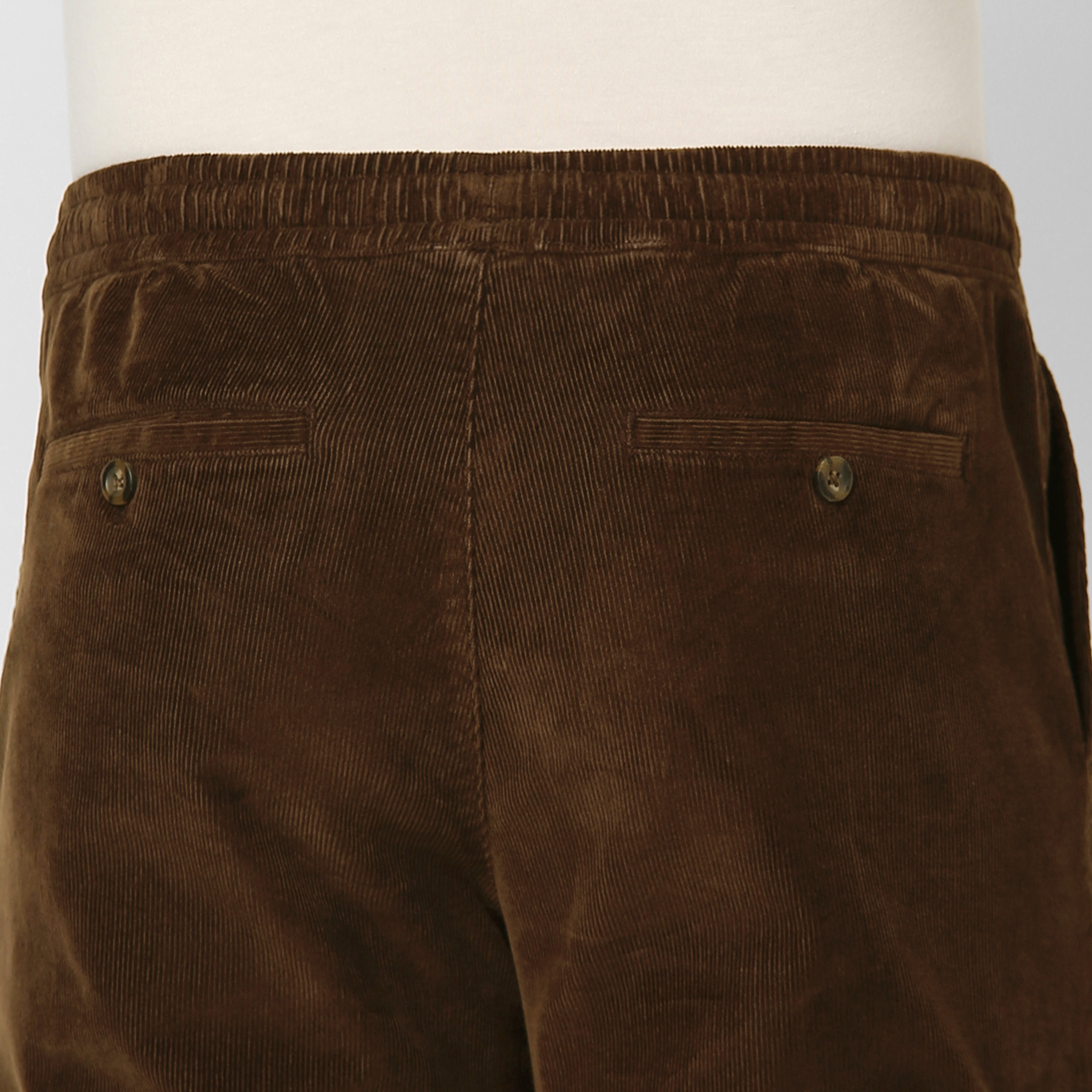 Corduroy Easy Pant Cocoa close up back button pockets on model