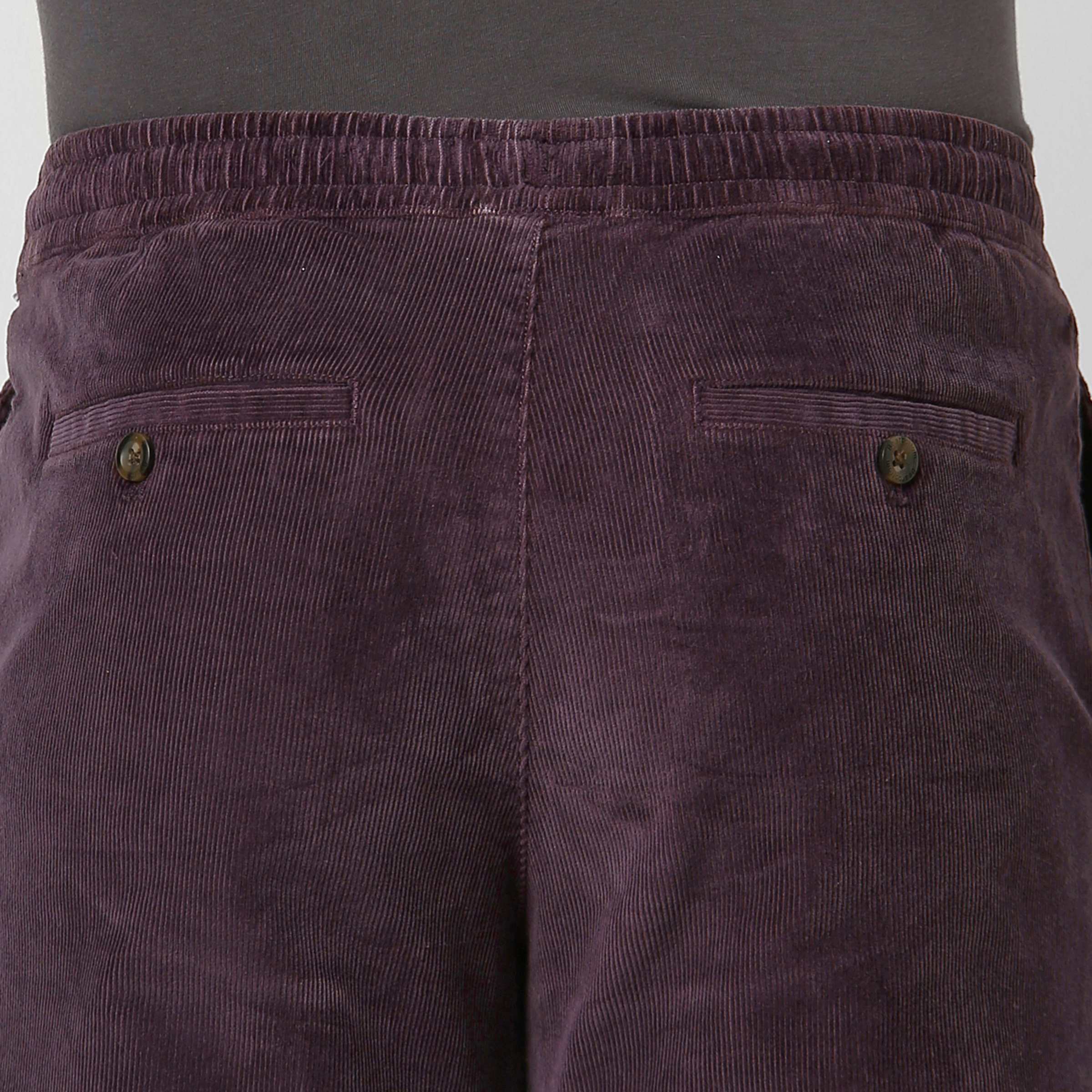 Corduroy Easy Pant Dark Purple close up back button pockets on model
