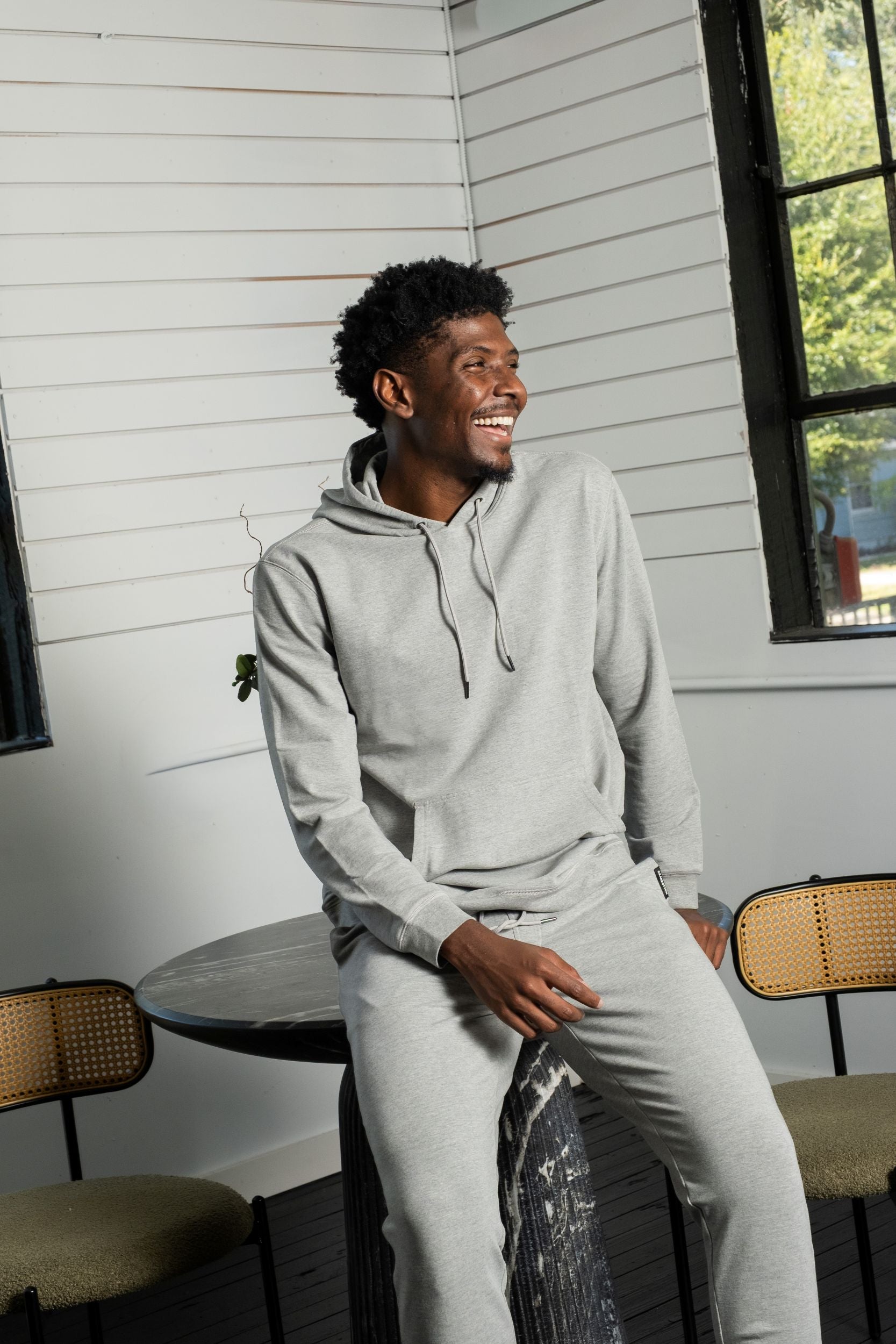 Man wearing Core Hoodie in Heather Grey and Core Cargo Sweatpant in Heather Grey