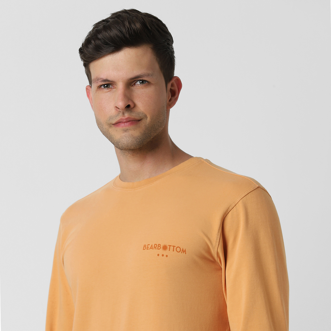 Natural Dye Graphic Long Sleeve - Surf City close up front on model with bearbottom logo graphic