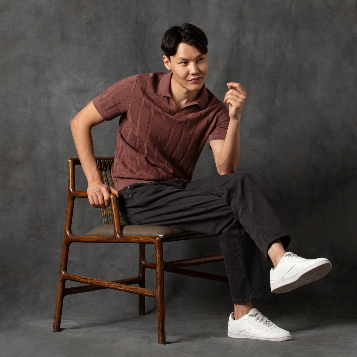 Ladder Knit Sweater Polo Deep Mauve charcoal backdrop full body on model sitting in chair