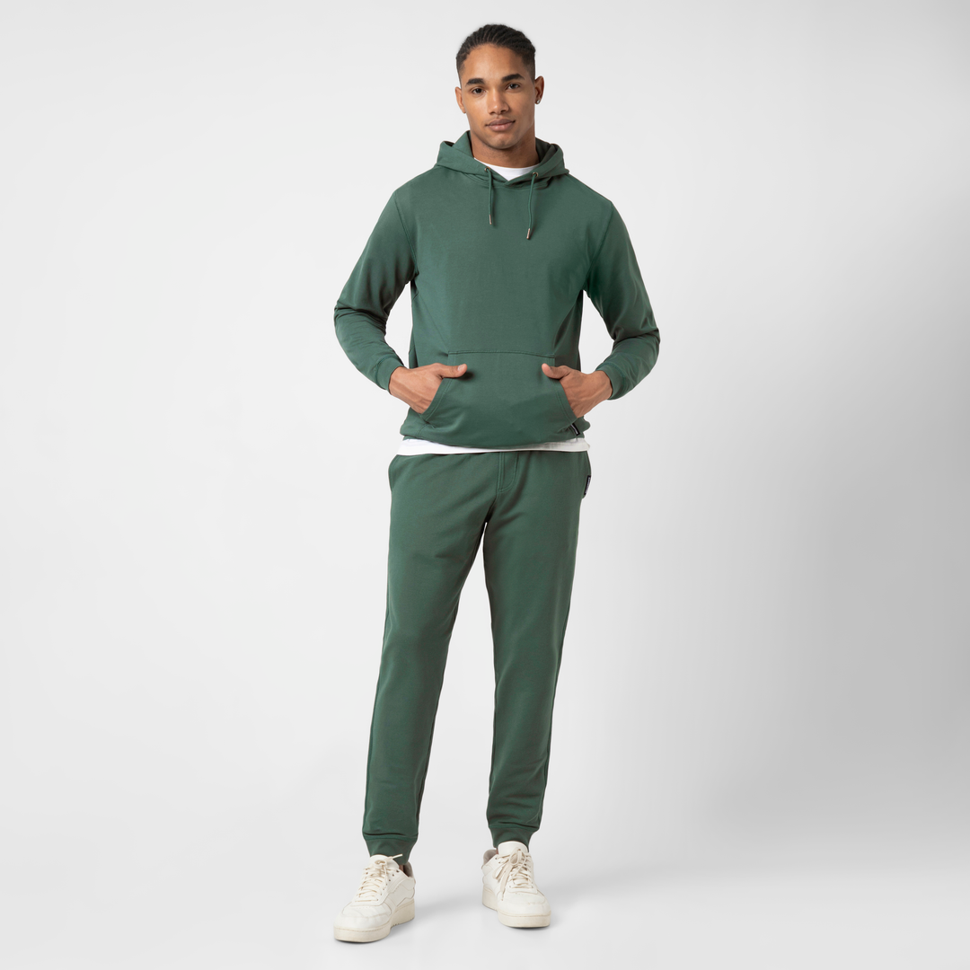 Lounge Jogger Dark Sage full body on model with Lounge Hoodie Dark Sage