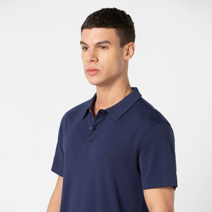 Midweight Supima Polo Navy front close up of collar and buttons on model