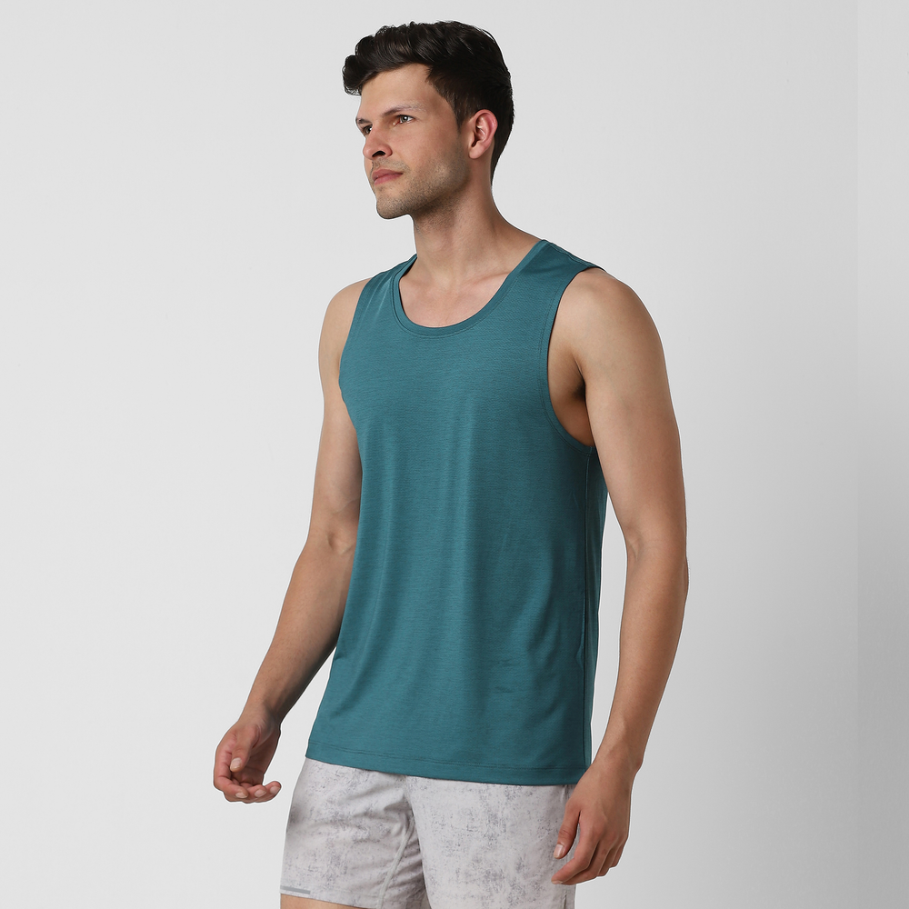 Pace Tank Dark Teal side on model