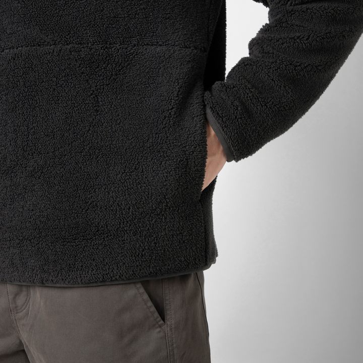 Quarter Snap Sherpa Pullover Black pocket close up on model