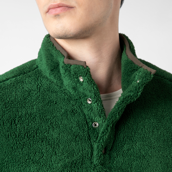 Quarter Snap Sherpa Pullover Duck Green collar close up on model