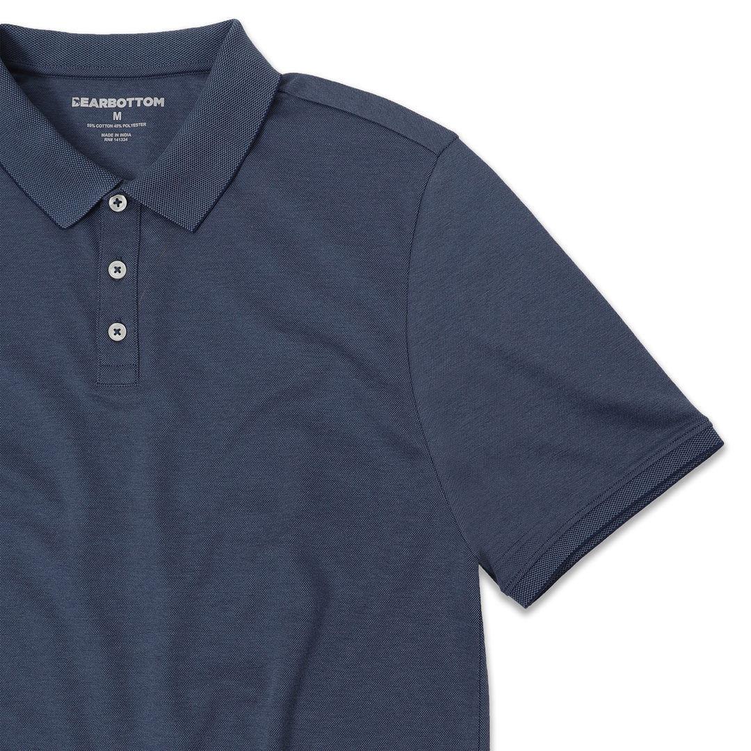 Range Polo Navy front close up with ribbed collar, ribbed short sleeves, and 3 white buttons