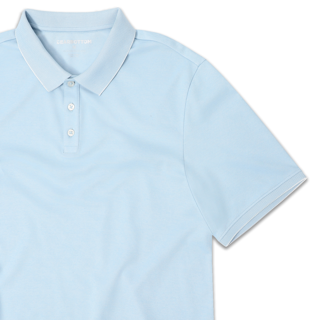 Range Polo Sky Blue front close up with ribbed collar, ribbed short sleeves, and 3 white buttons
