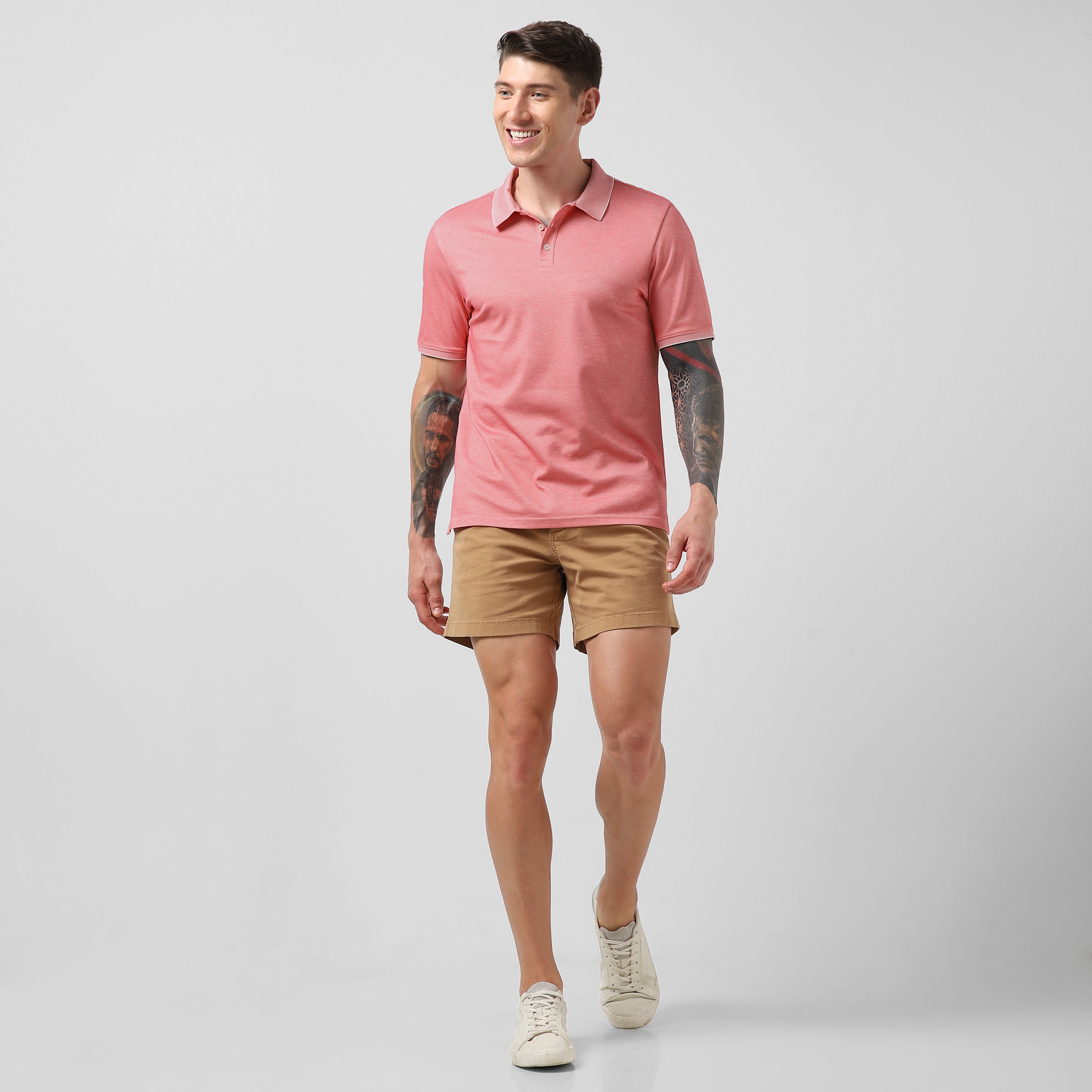 Range Polo Coral full body on model wearing Stretch Shorts Camel