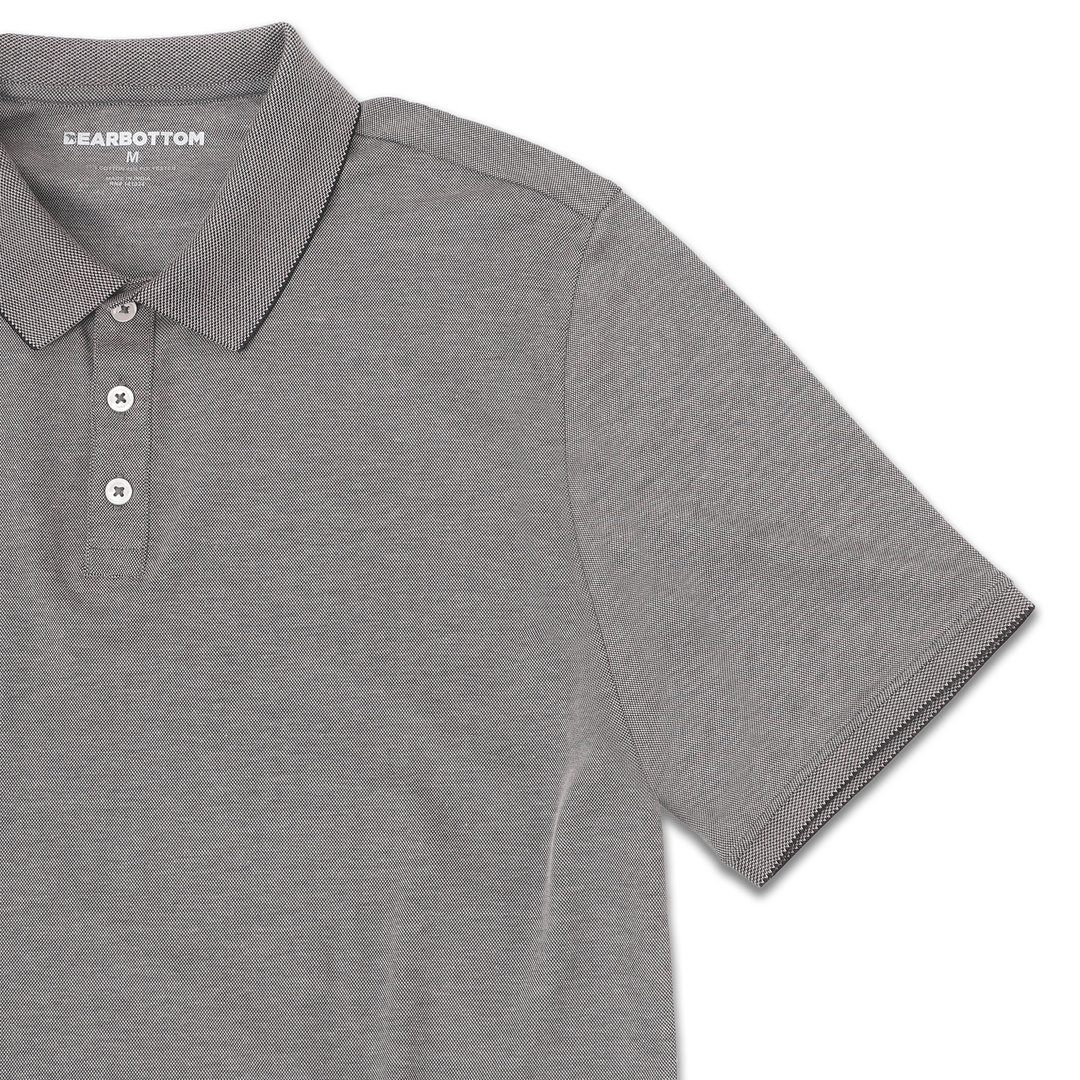 Range Polo Charcoal front close up with ribbed collar, ribbed short sleeves, and 3 white buttons