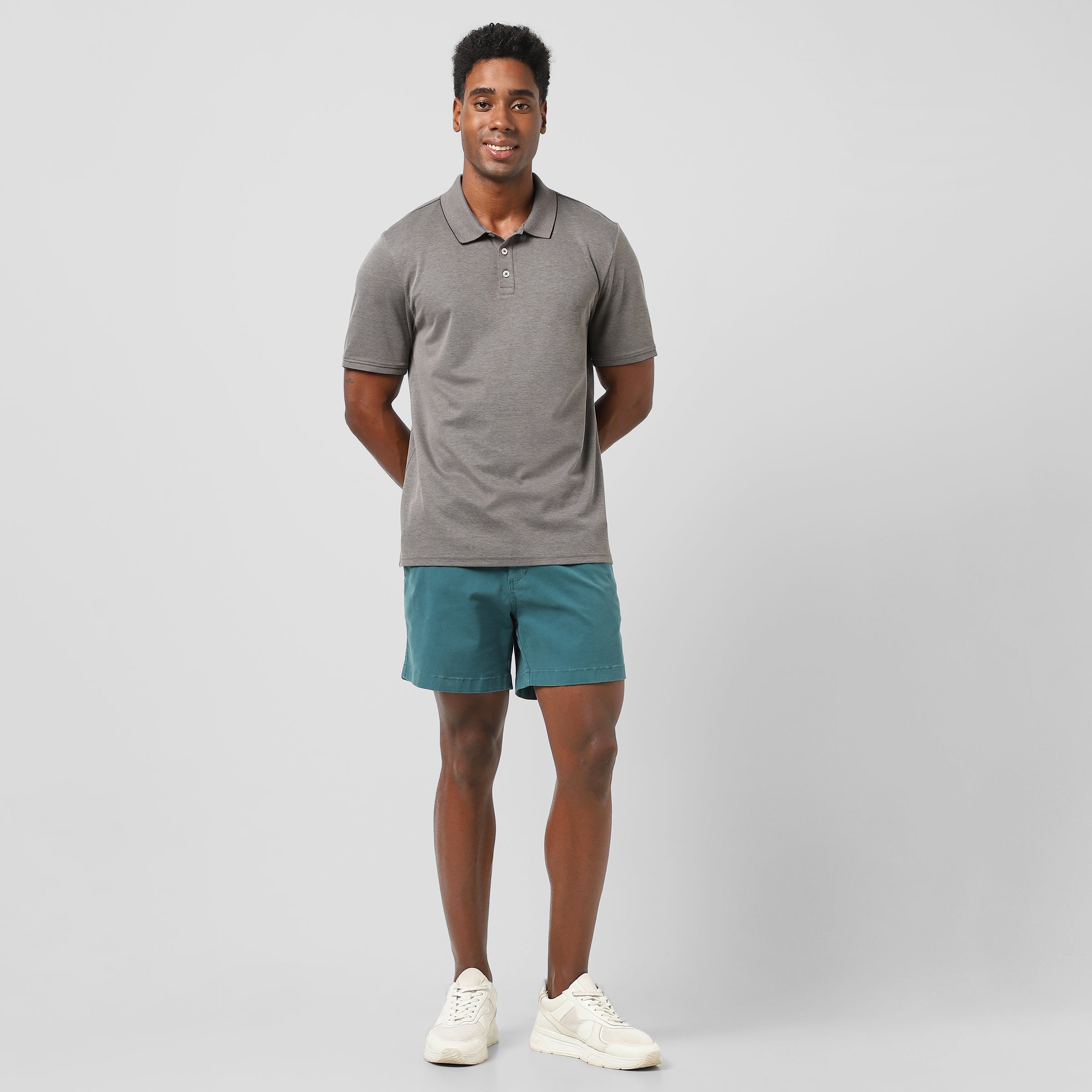 Range Polo Charcoal full body on model worn with Stretch Short Marine