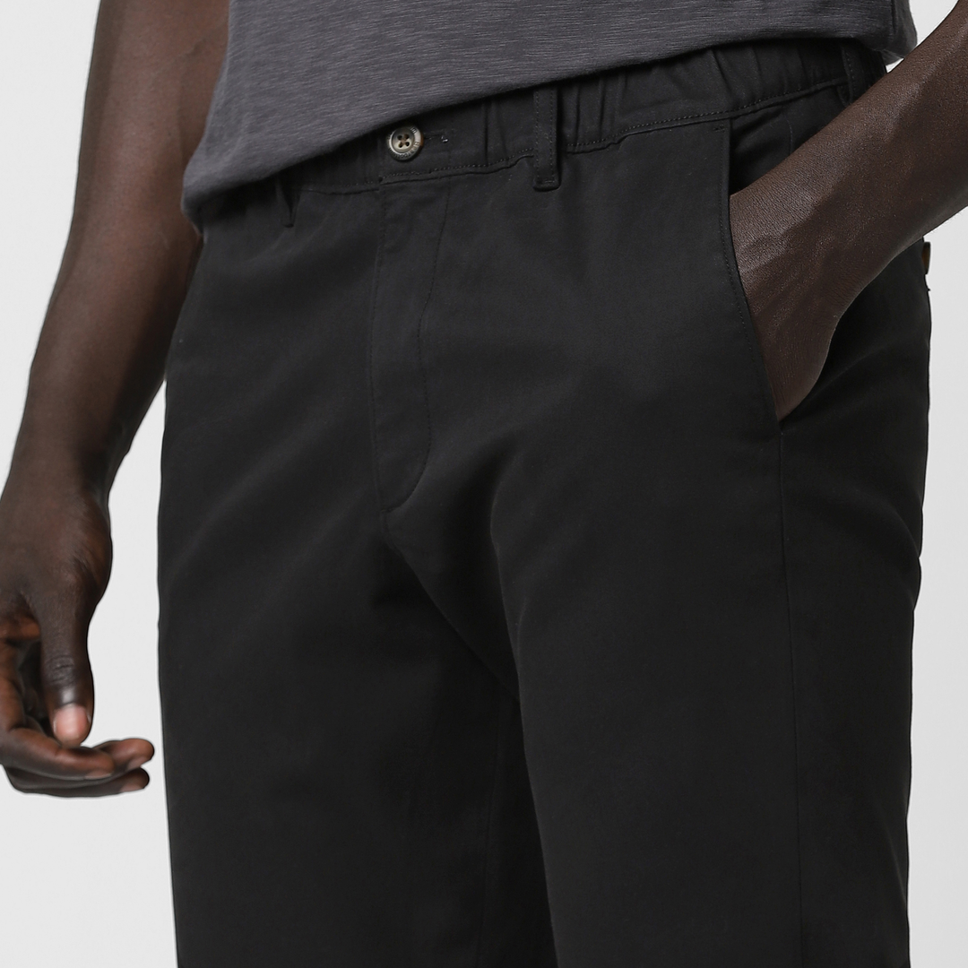 Relaxed Stretch Chino Pant Black close up front left pocket on model