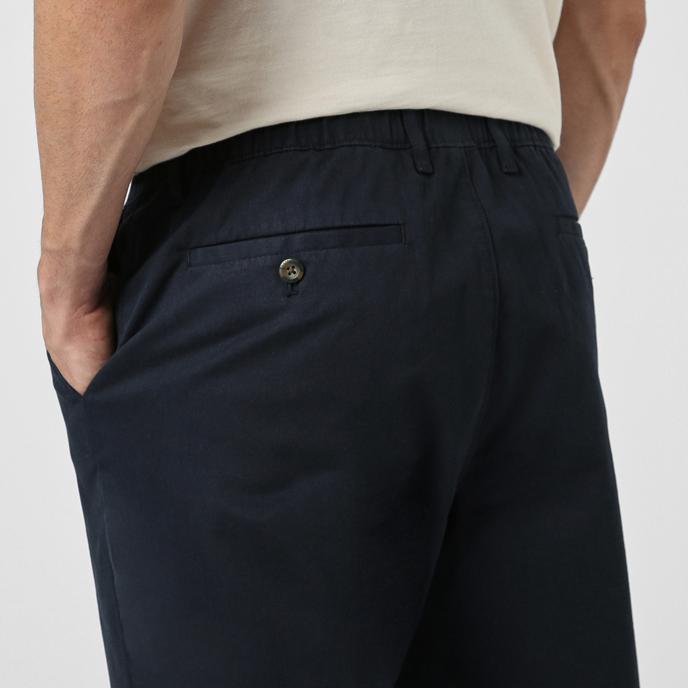Relaxed Stretch Chino Pant Navy close up back left pocket on model