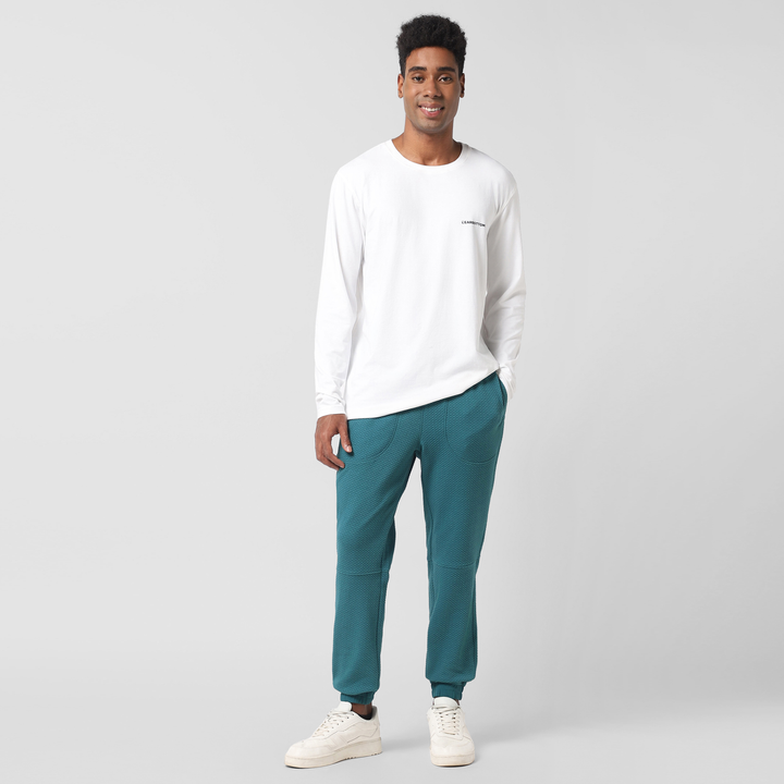 Roam Jogger Dark Teal on model worn with Natural Dye Logo Long Sleeve White