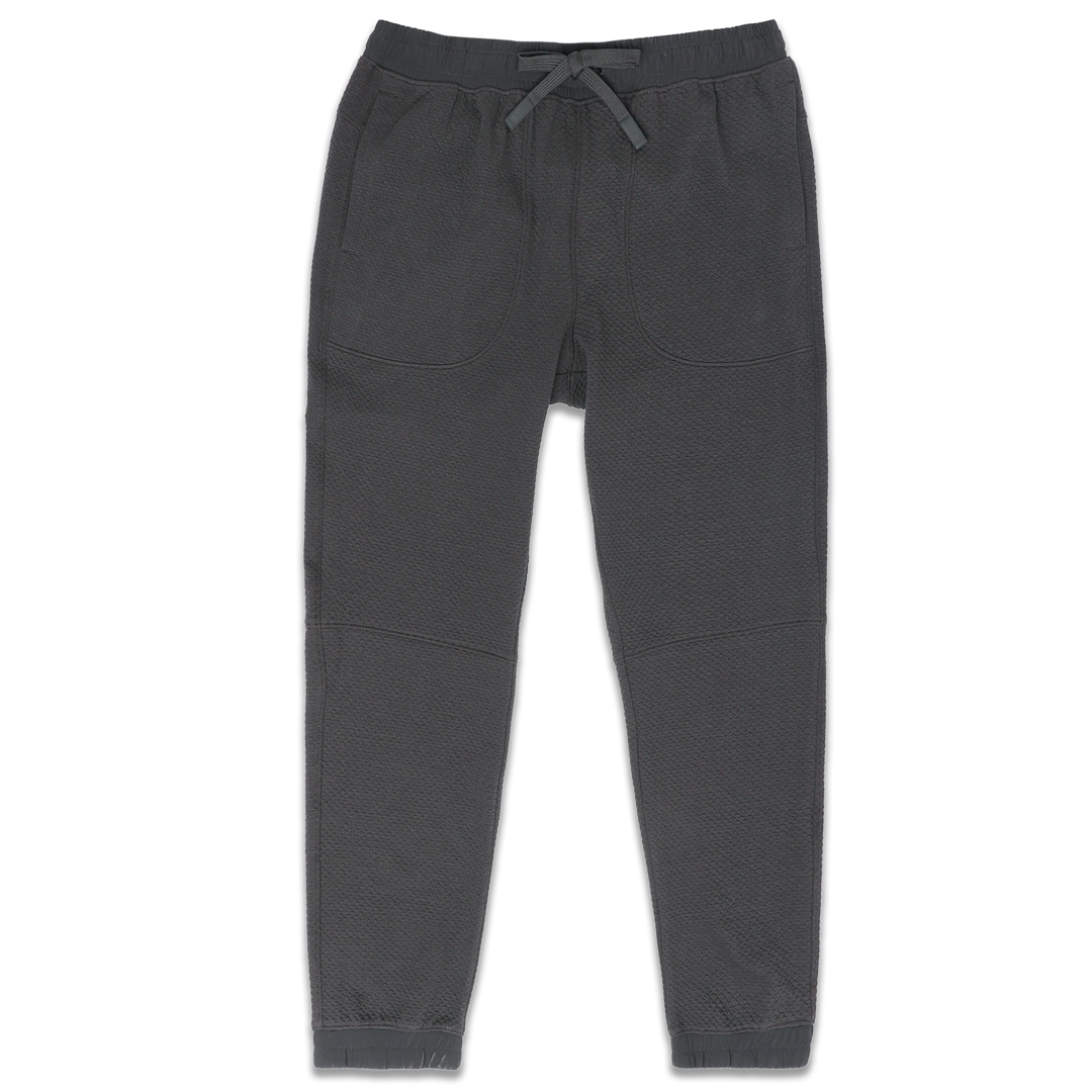 Roam Jogger Coal front with an elastic wstband, two side seam pockets, dyed to match drawstring, and ribbed ankle cuffs