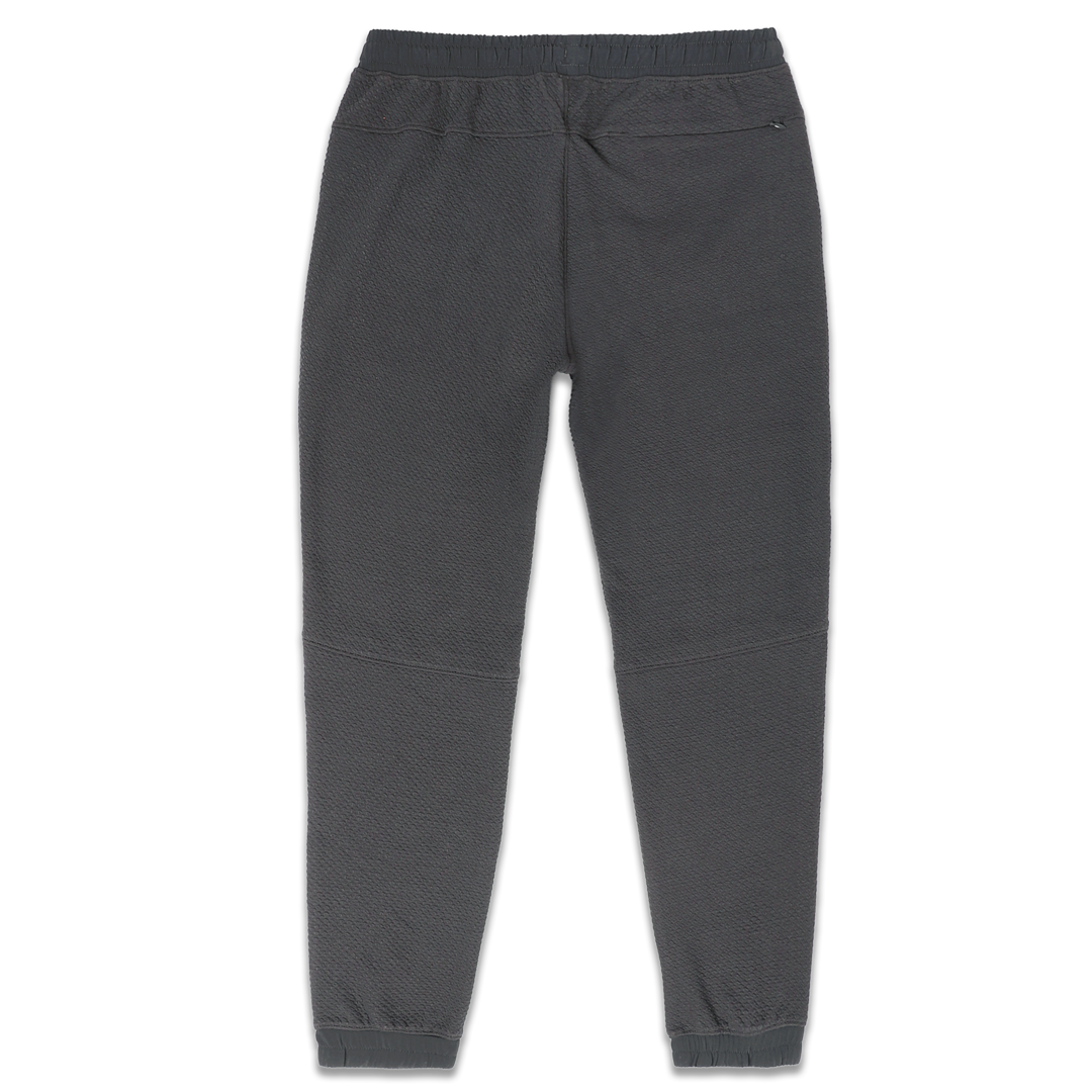 Roam Jogger Coal back with an elastic waistband, back right zipper pocket, and ribbed ankle cuffs
