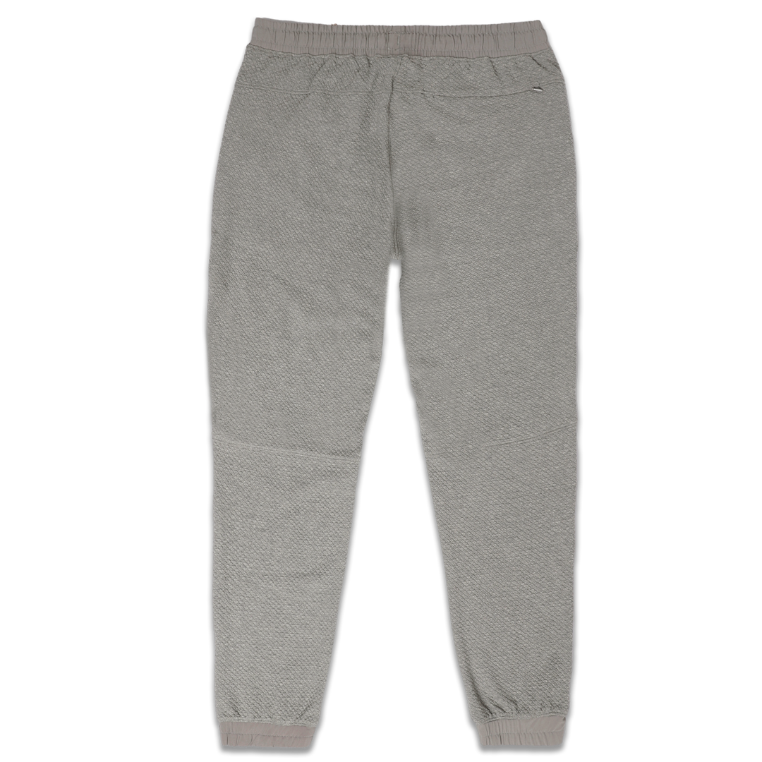 Roam Jogger Heather Grey back with an elastic waistband, back right zipper pocket, and ribbed ankle cuffs