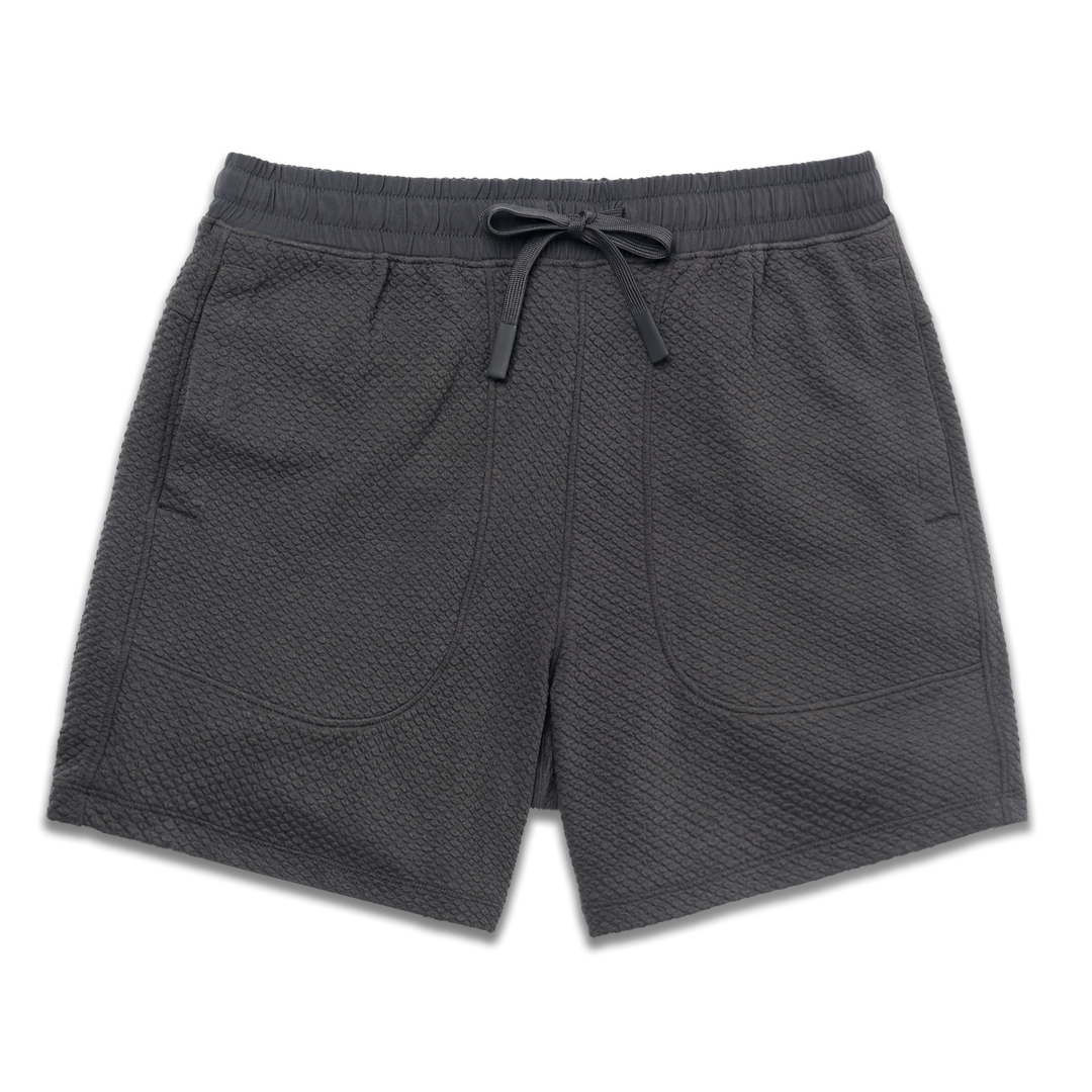 Roam Short 5.5" Coal front with an elastic waistband, two side seam pockets, and dyed to match drawstring