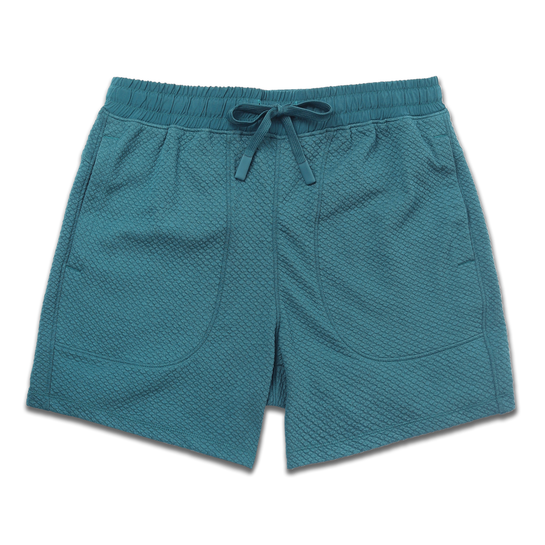 Roam Short 5.5" Dark Teal front with an elastic waistband, two side seam pockets, and dyed to match drawstring