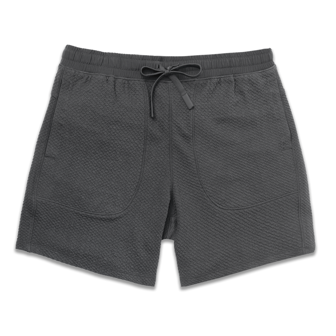 Roam Short 7" Coal front with an elastic waistband, two side seam pockets, and dyed to match drawstring