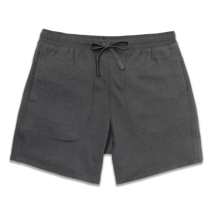 Roam Short 7" Coal front with an elastic waistband, two side seam pockets, and dyed to match drawstring