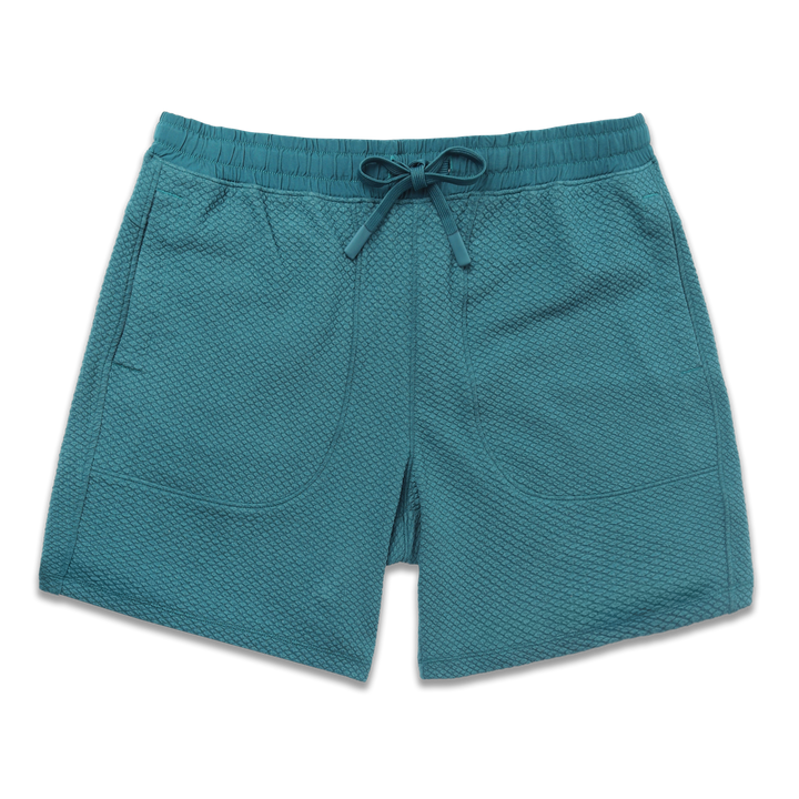 Roam Short 7" Dark Teal front with an elastic waistband, two side seam pockets, and dyed to match drawstring