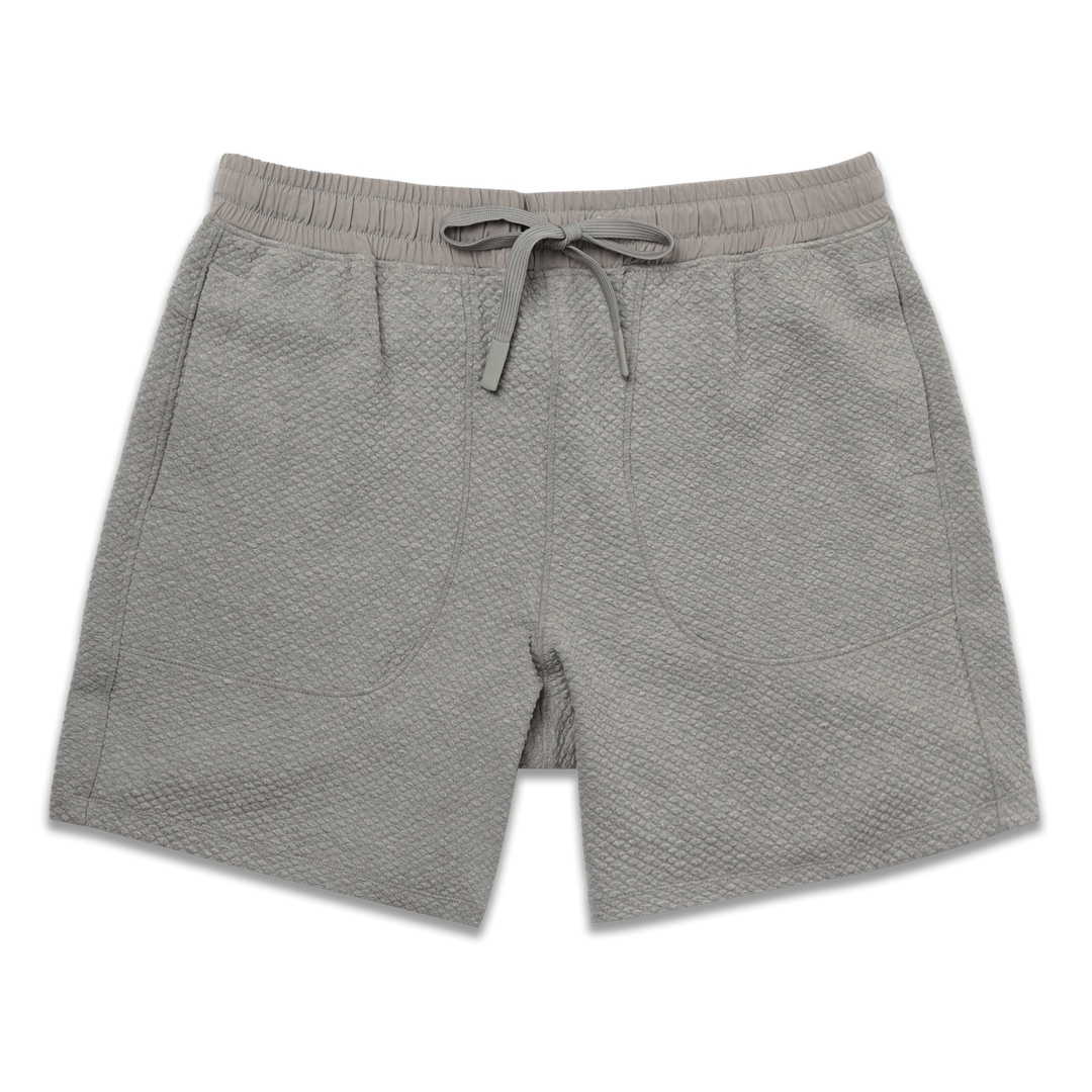Roam Short 7" Heather Grey front with an elastic waistband, two side seam pockets, and dyed to match drawstring