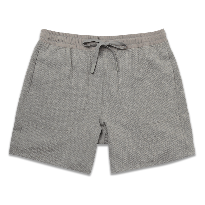Roam Short 7" Heather Grey front with an elastic waistband, two side seam pockets, and dyed to match drawstring