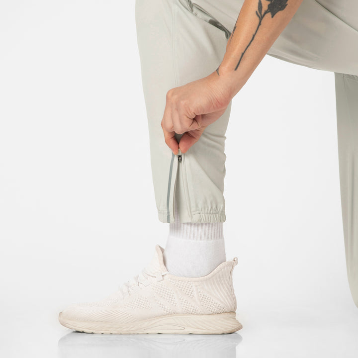 Run Jogger Light Grey close up of bottom leg hem zipper with reflective tape