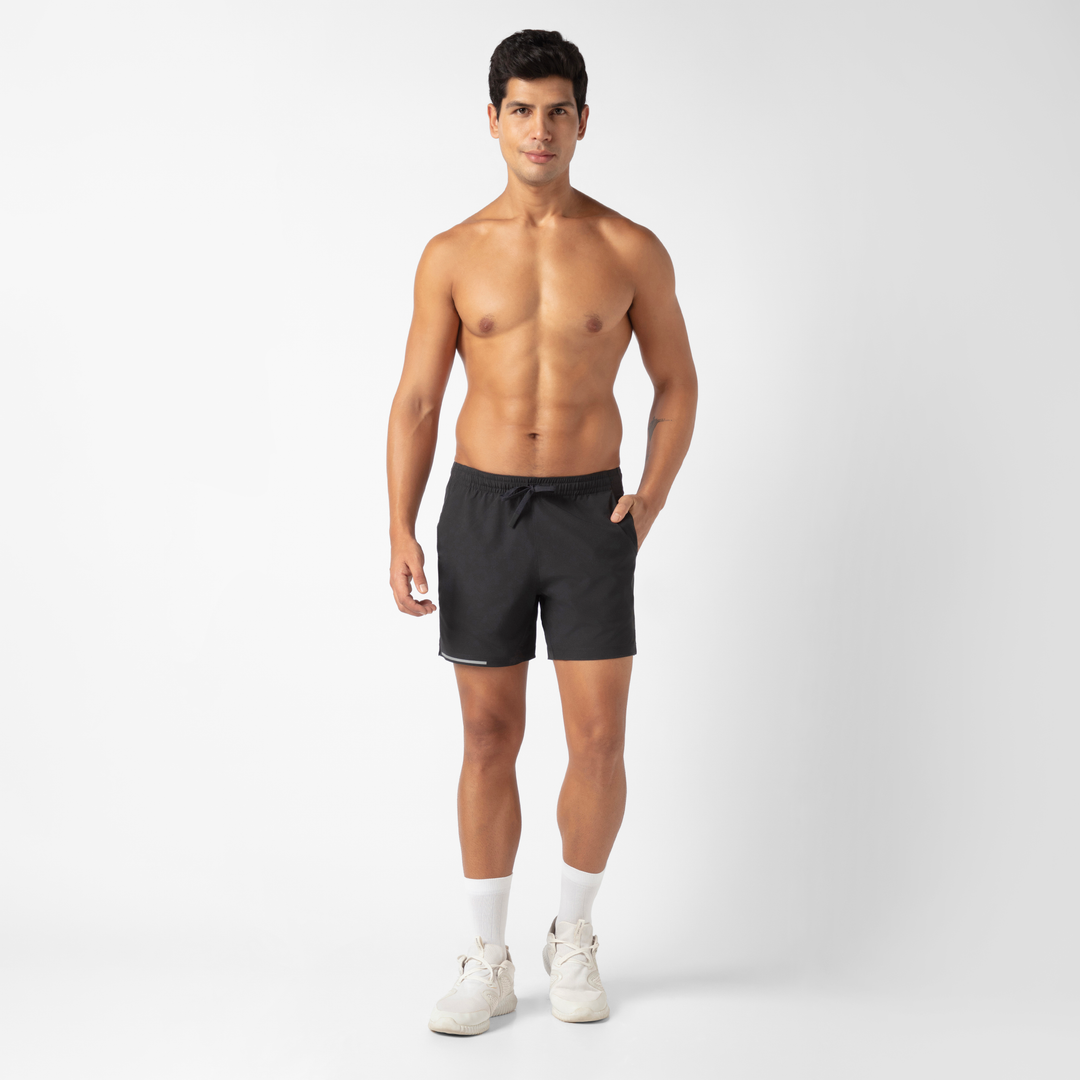 Run Short v2 5.5" in Black front on model standing with hand in pocket