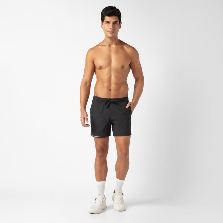 Run Short v2 5.5" in Black front on model standing with hand in pocket