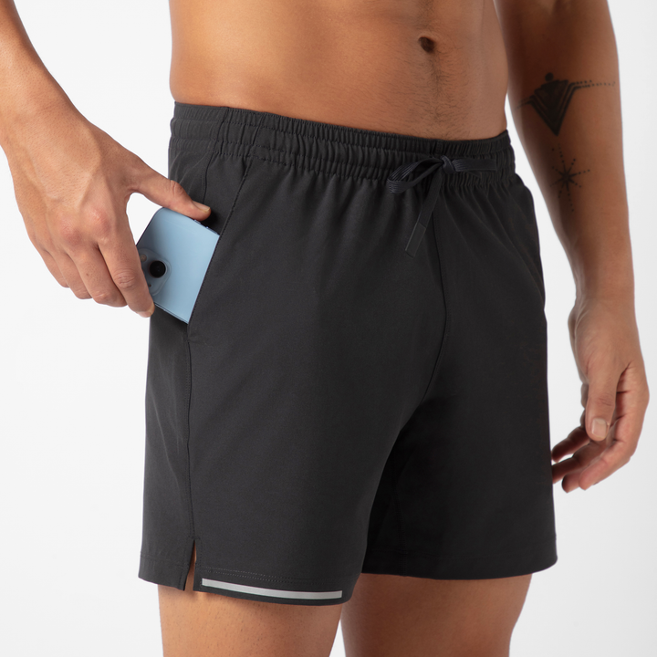 Run Short v2 5.5" in Black front on model close up of phone pocket